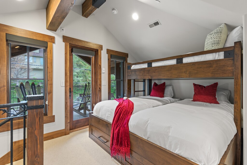 Sleep soundly in this unique bunk room, featuring 3 cozy twin beds and access to a private balcony.