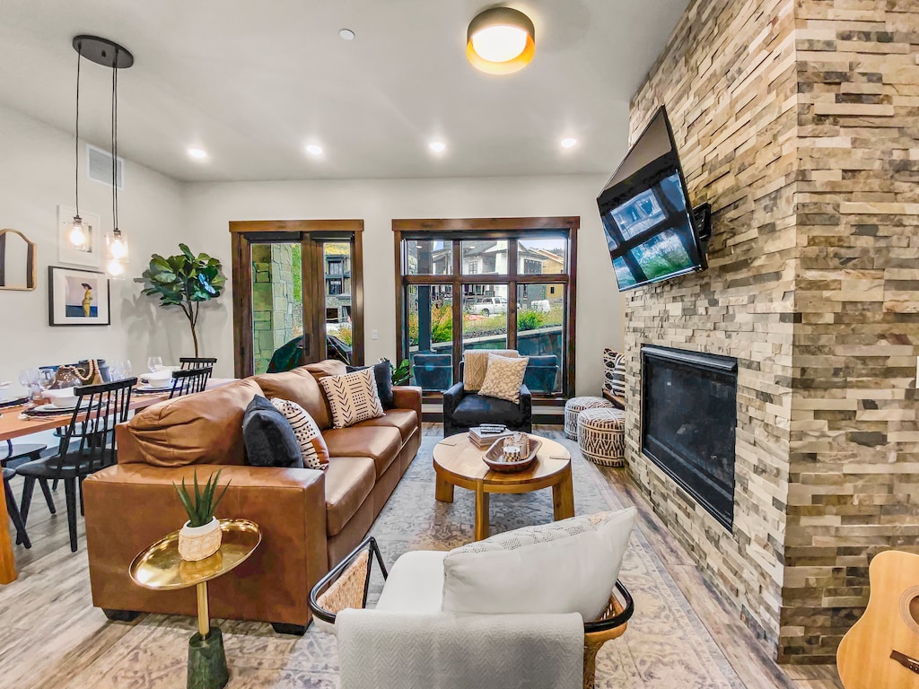 Cozy Living Room with Fireplace and Big Screen TV