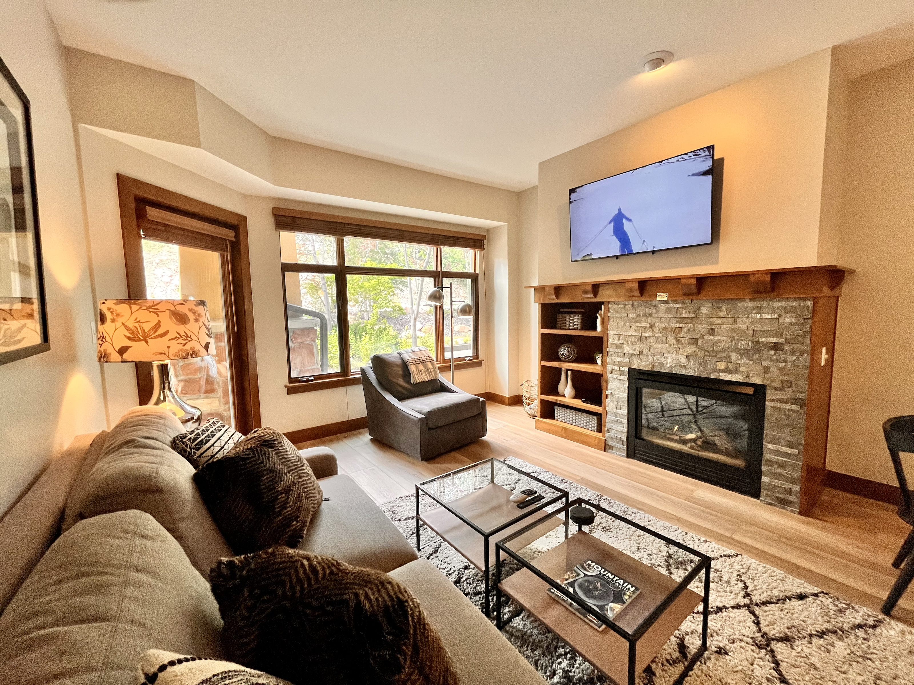 Cozy Living Room with Fireplace and Big Screen TV