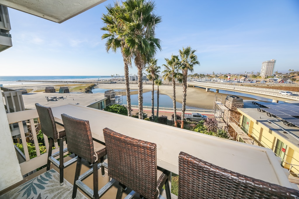 Iconic lighthouse, charming shops, and endless ocean blues – all from your private balcony.