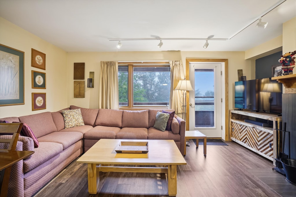 Spacious modestly decorated living room, access to private deck.