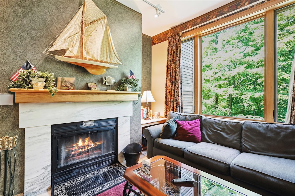 Bright, comfortable living space with large windows overlooking the trees. Relax by the wood-burning fireplace or unwind on the sectional after a day on the mountain.