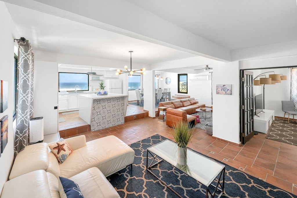 Woven, upholstered couch plus two matching armchairs
Courtesy coffee table