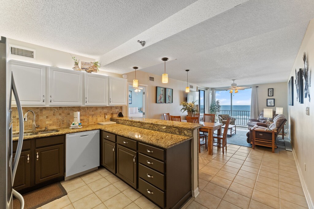 Open concept kitchen looking into living space.