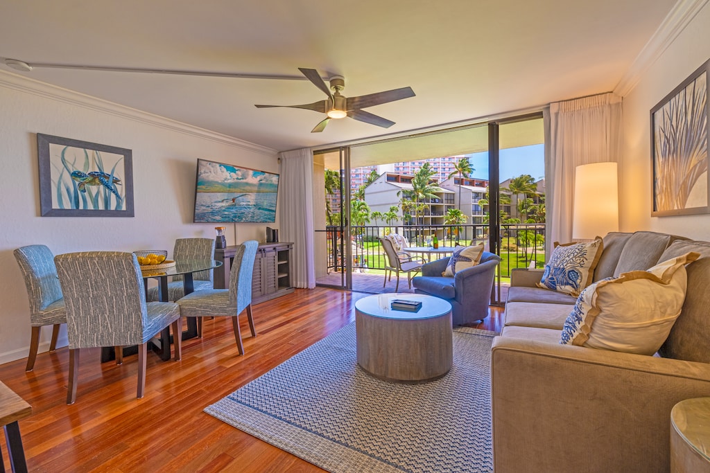 Bright living area at Kaanapali Shores 213 with comfy seating and lanai access.