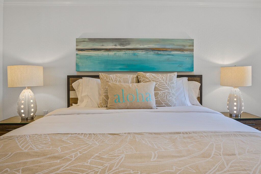 Rest easy in the king bed at Kaanapali Shores 213, styled with calming tropical decor.