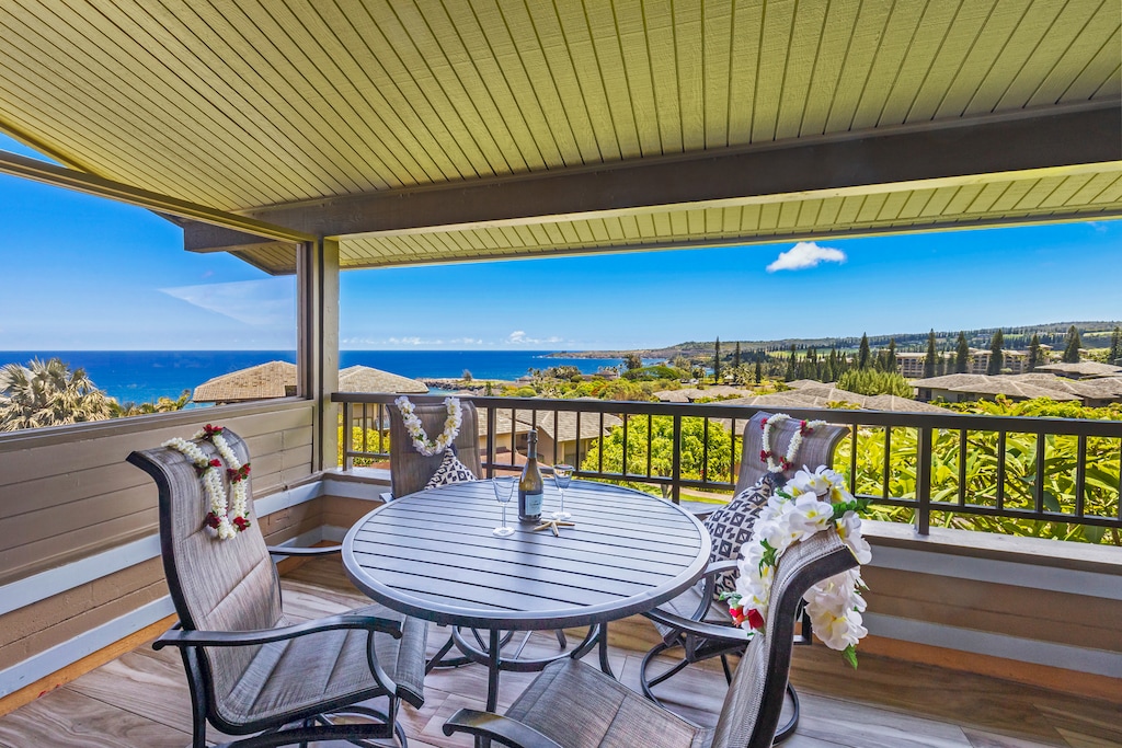 Dine on the lanai at Kapalua Ridge 1421 with stunning ocean and lush tropical views.