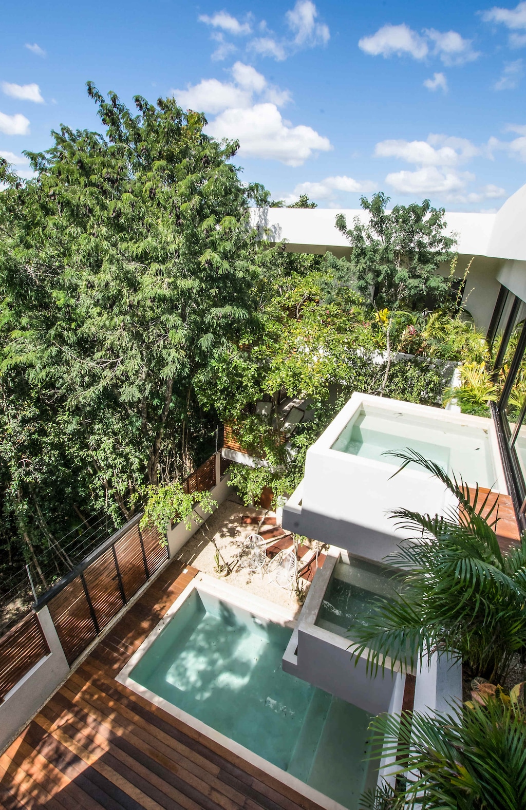 Captivating views from the villa’s two private plunge pools and the main pool, surrounded by lush tropical scenery.
