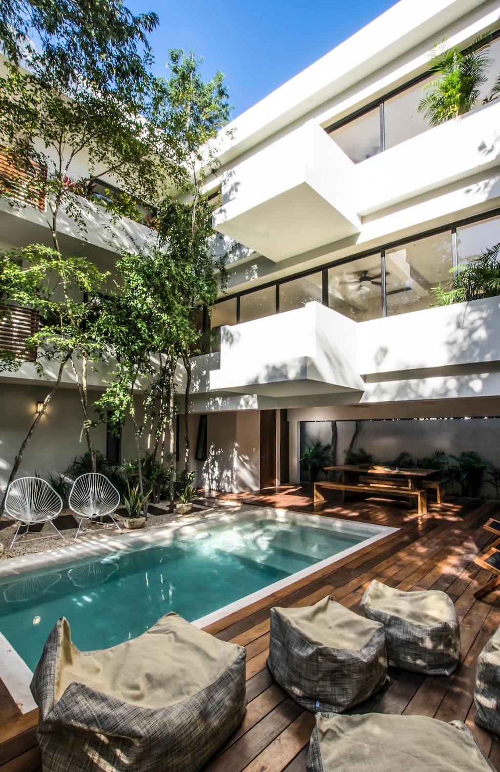 Elegant villa featuring serene pool views and a stylish outdoor area designed for leisure and enjoyment.