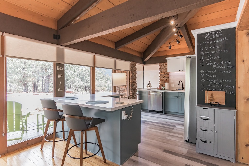 The newly remodeled kitchen features new everything! The mid-century Craftsman look is especially evident in the kitchen and breakfast bar.
