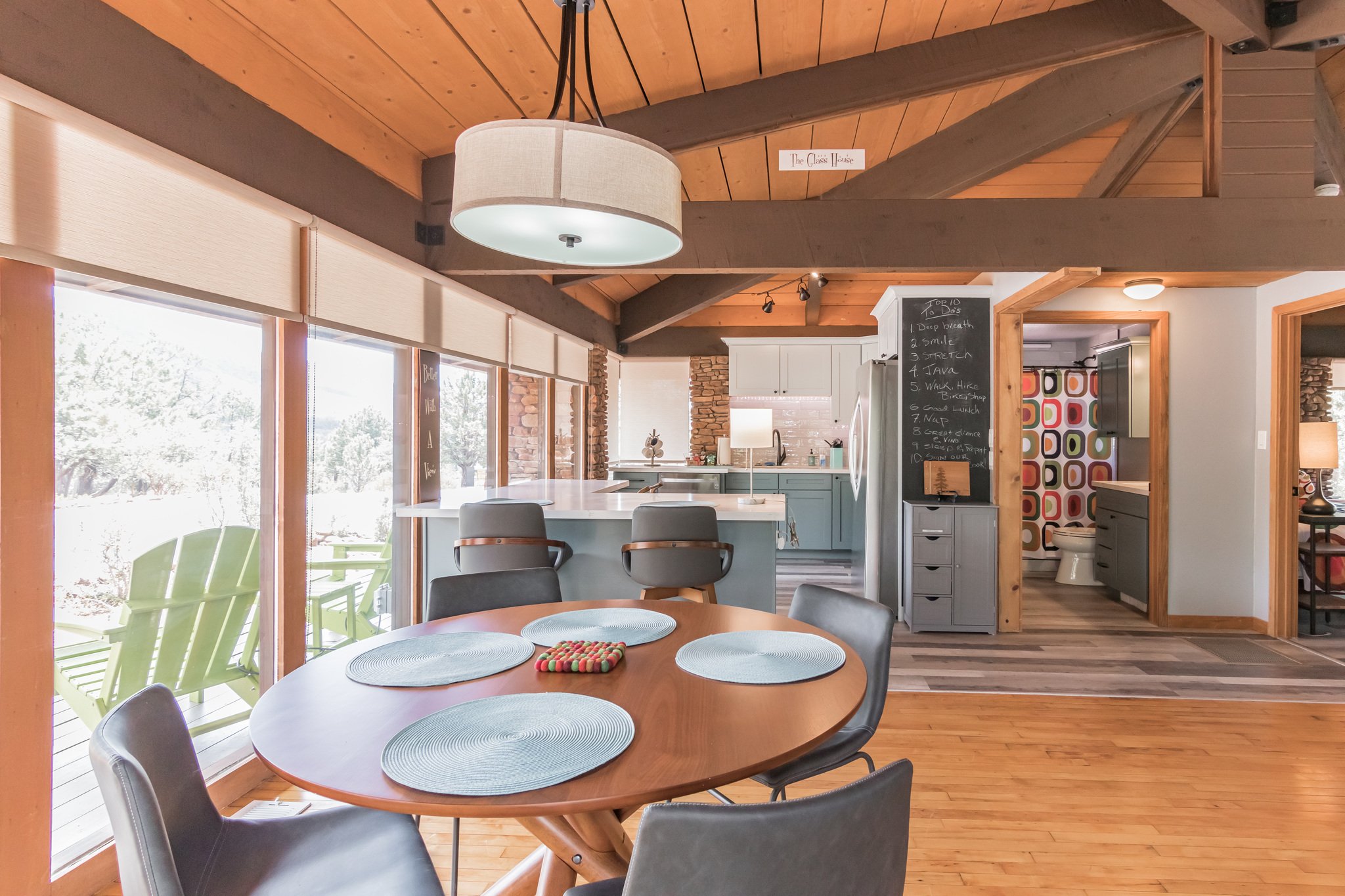 Every space in The Glass House is curated with thought and intentionality. The indoor dining space overlooks the wraparound deck so you can enjoy the view from every angle.