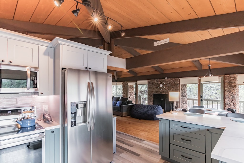 The exposed beams throughout The Glass House are a highlight of the space.