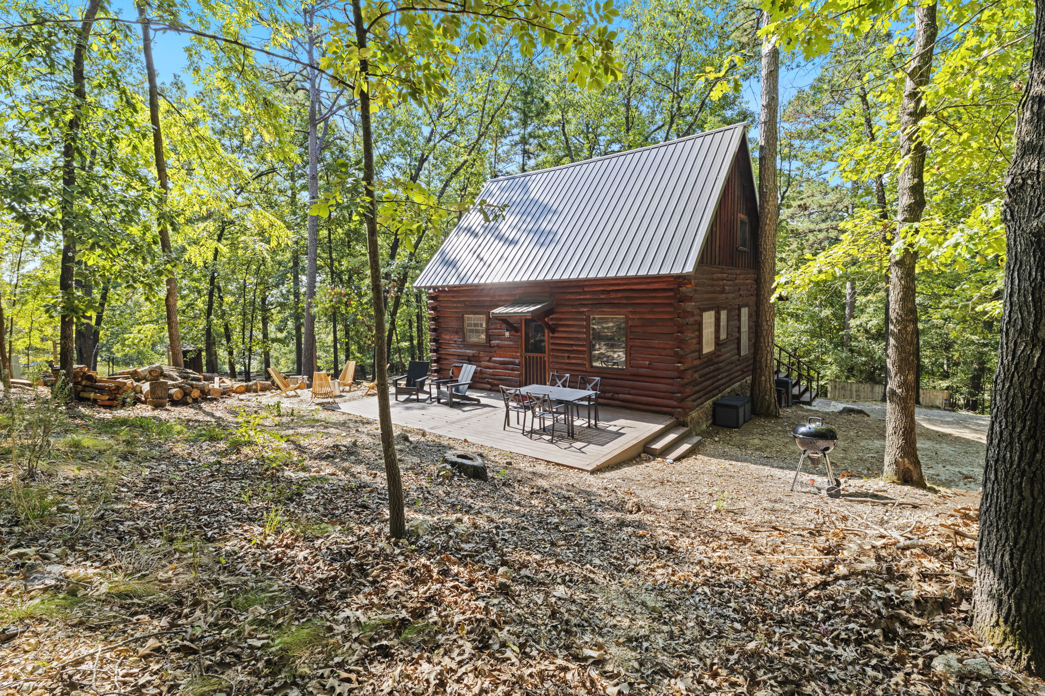 On the back deck, you’ll find our outdoor dining table, two deck chairs, hammock, and fire pit.