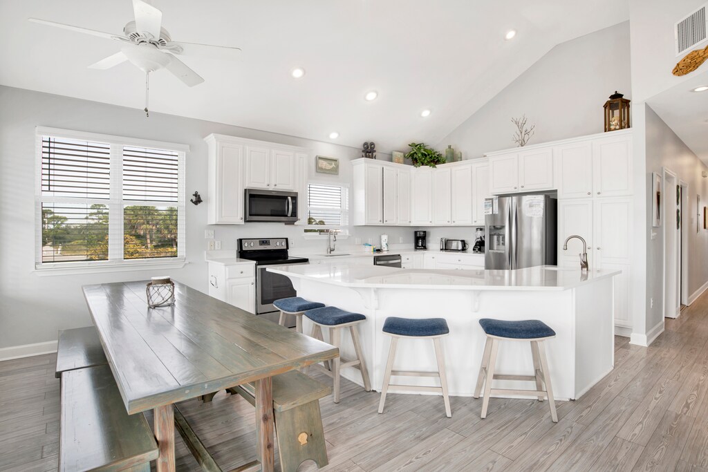Large dining table with additional seating at the bar