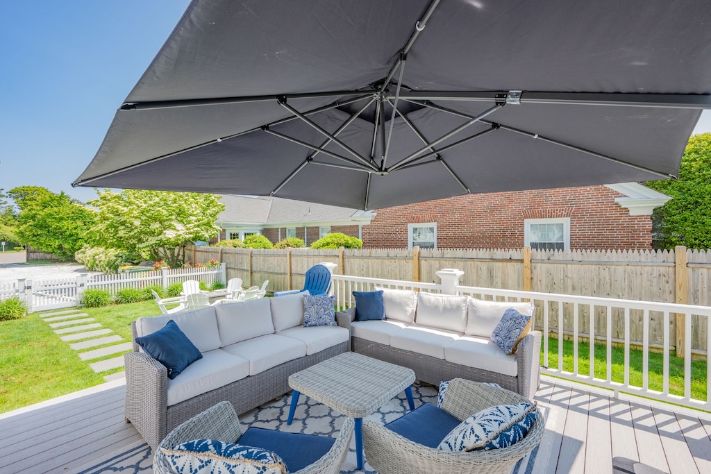 The Pineapple House side deck with ample comfortable seating for relaxing after a long day on Cape Cod