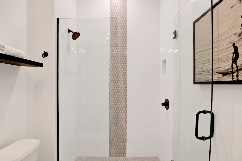 Featuring a walk-in tile shower