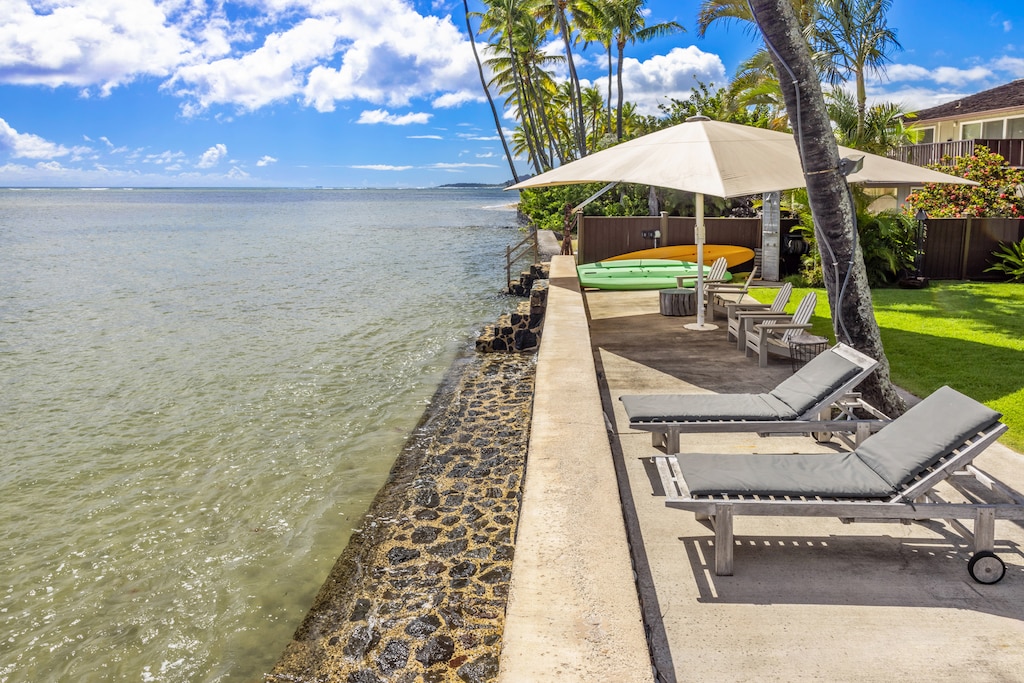 Relax on oceanfront loungers just steps from the sea.