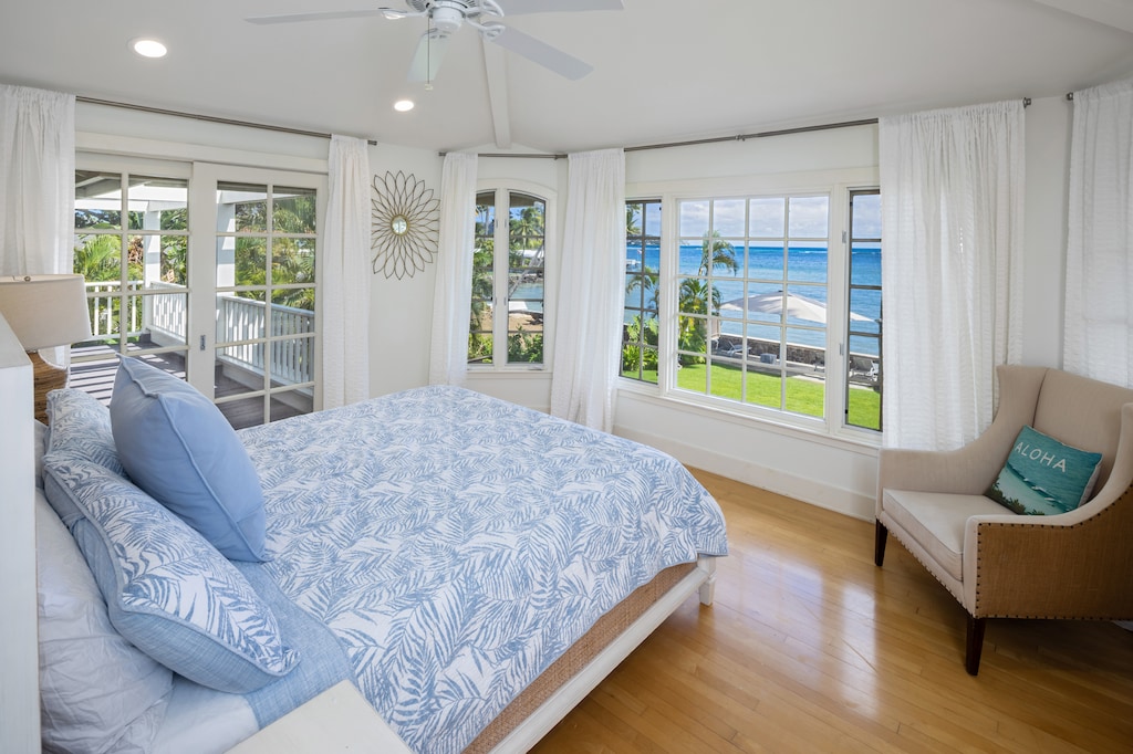 Primary Bedroom 2 with sweeping ocean views, king bed, and bright natural light.