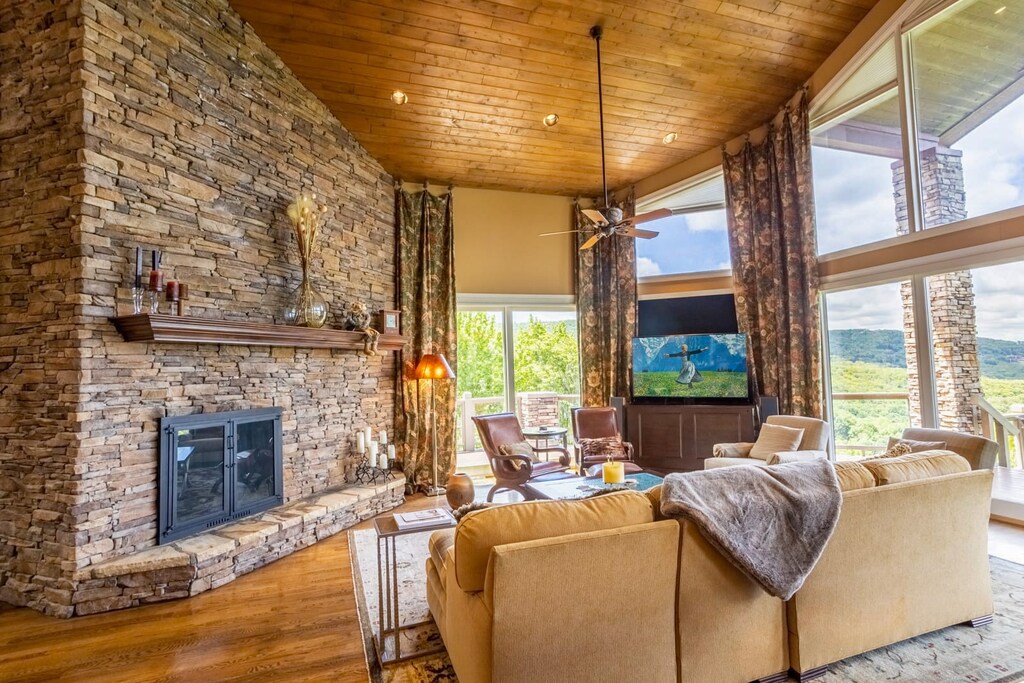 Tongue and Groove Ceilings and Stacked Rock Gas Fireplace in the Spacious Living Room