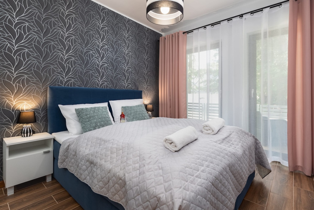 A large window in the bedroom allows for plenty of natural light. 