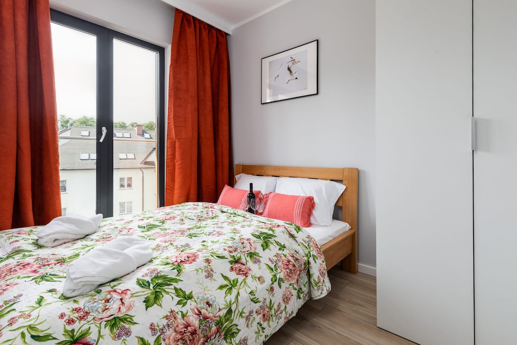 The cosy bedroom features a luxurious double bed and ample storage.