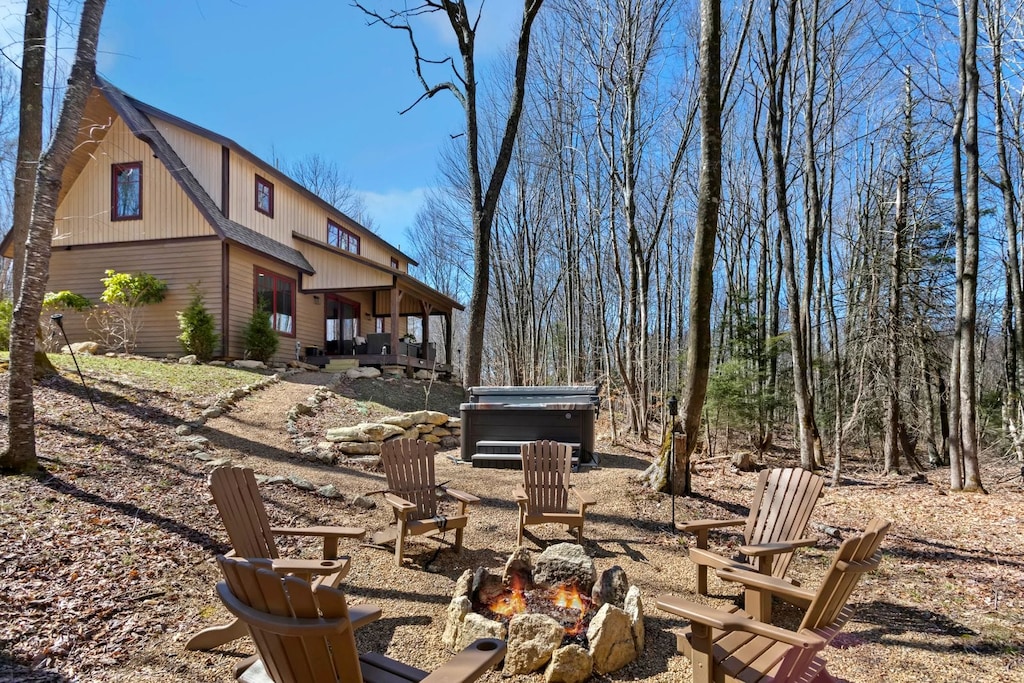 Wood Burning Fire Pit with Adirondack Chairs, Hot Tub Above and Creek Running By