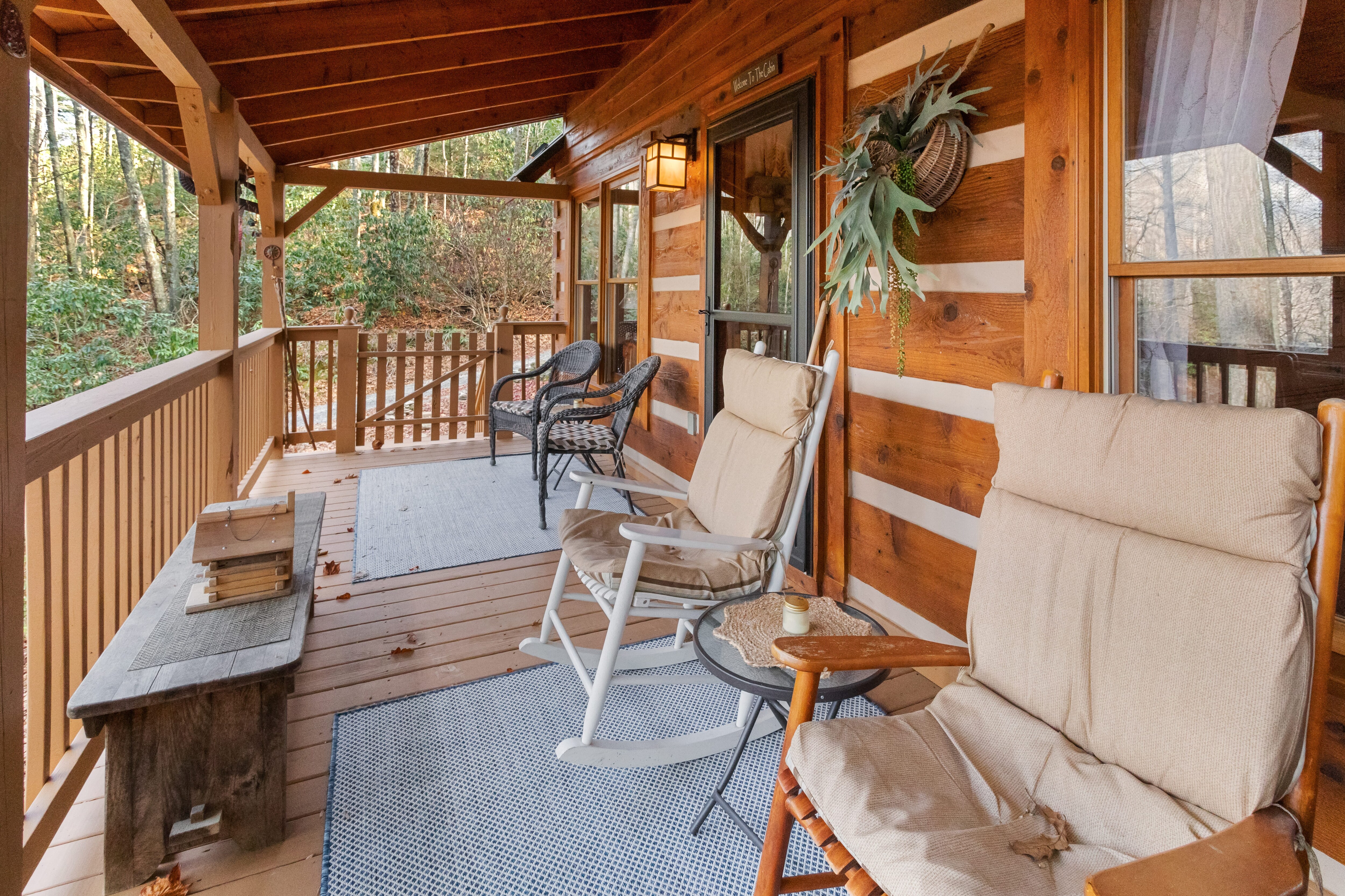 Covered Porch with Comfortable Seating and Gas Grill