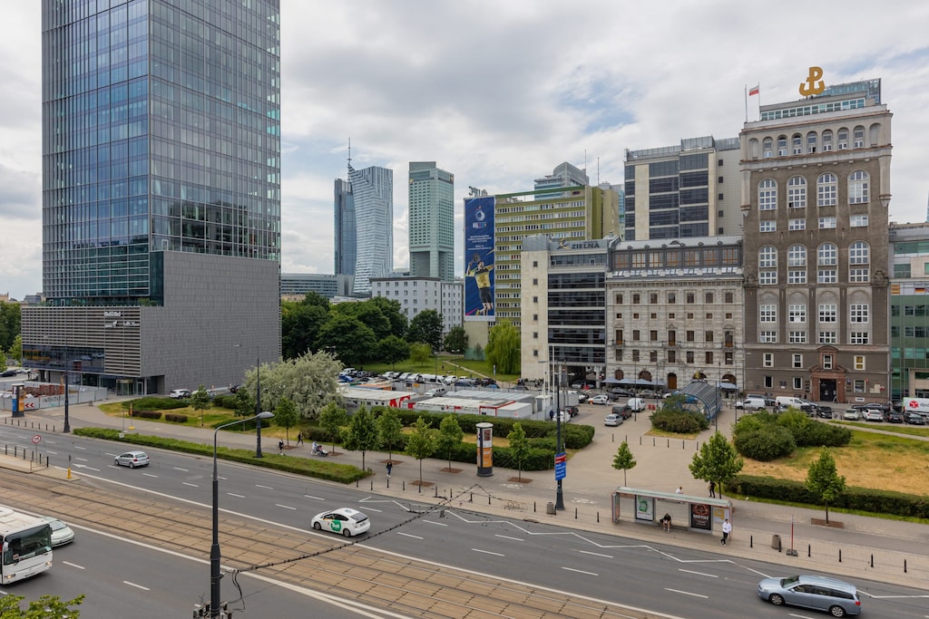 A cityscape view from the apartment, showcasing modern buildings and urban charm.
