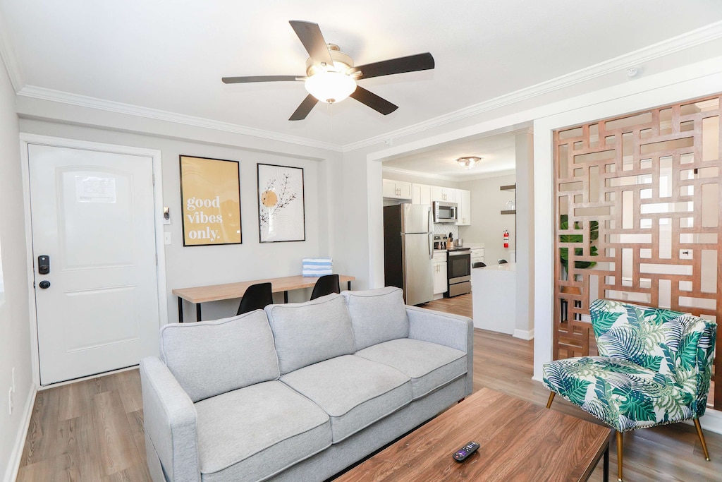 Living room with a view of kitchen.
