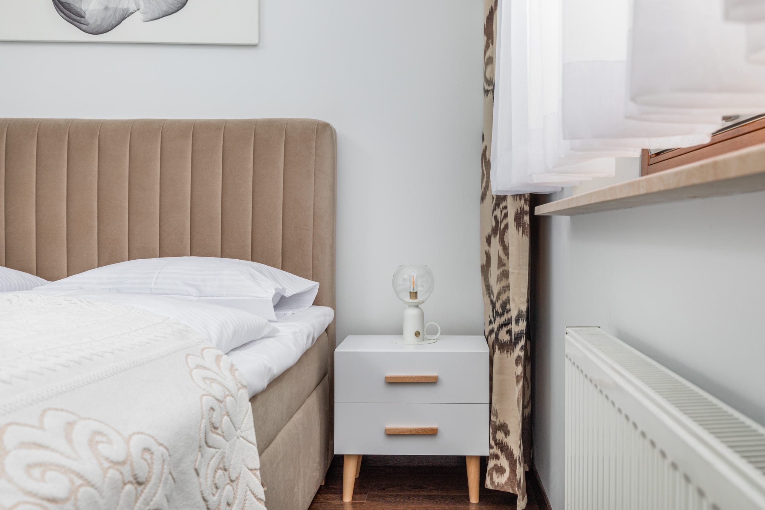 Cozy bedroom with a comfortable double bed, soft bedding, and natural light.
