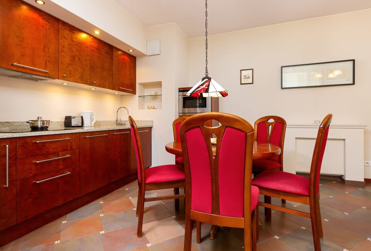 Large table with chairs for eating communal meals. 