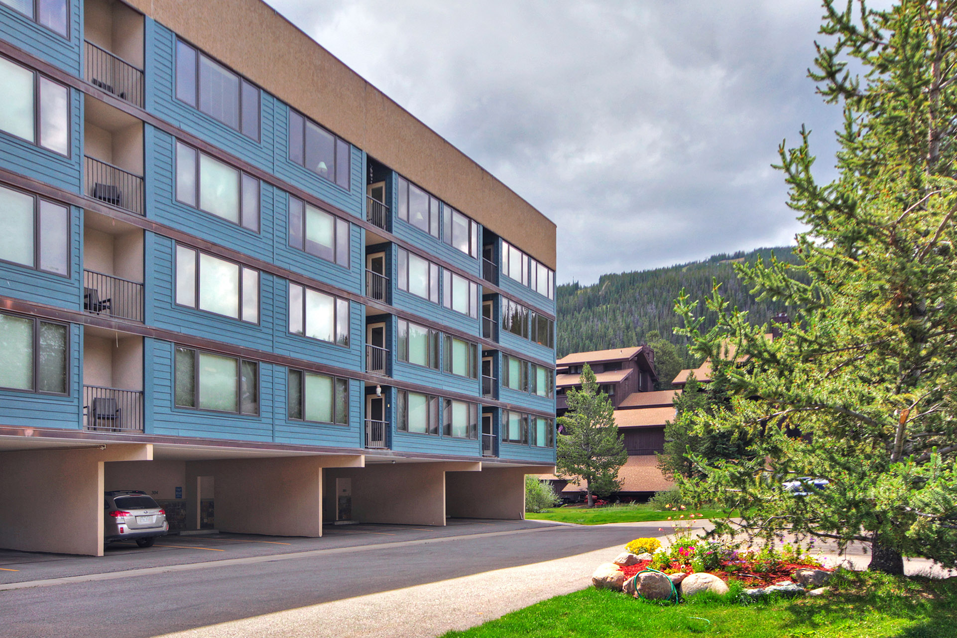 Summit House parking covered parking spots with views of Copper Mountain in the background.