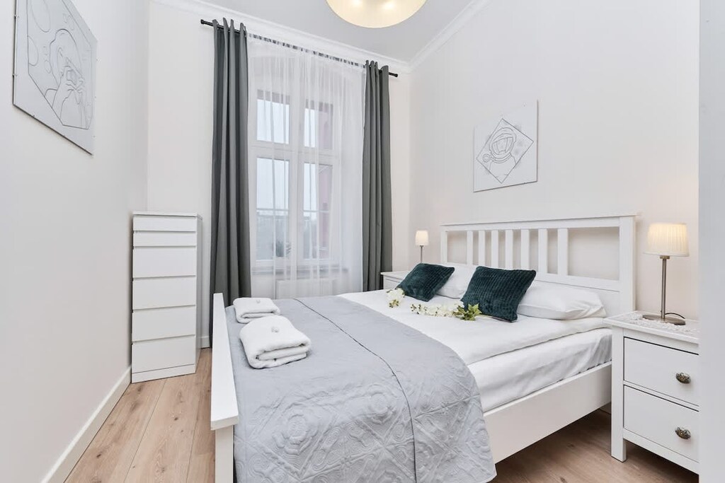 The cosy bedroom features a luxurious double bed and ample storage.