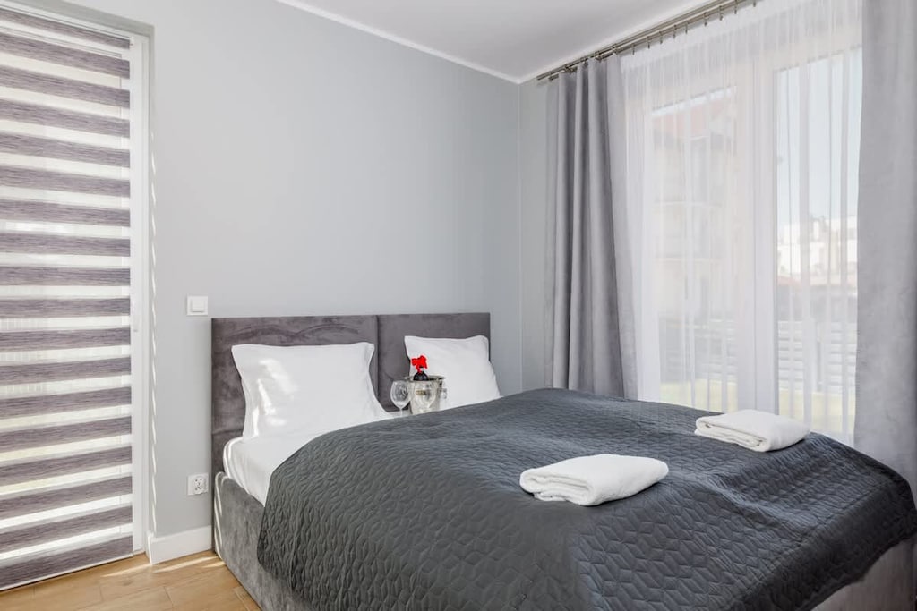 Bedroom with a double bed and capacious wardrobe.