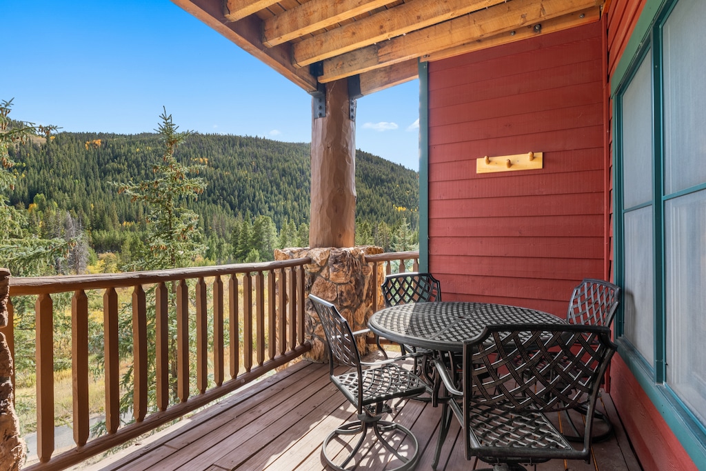 Spacious private balcony with outdoor seating and incredible mountain views. 