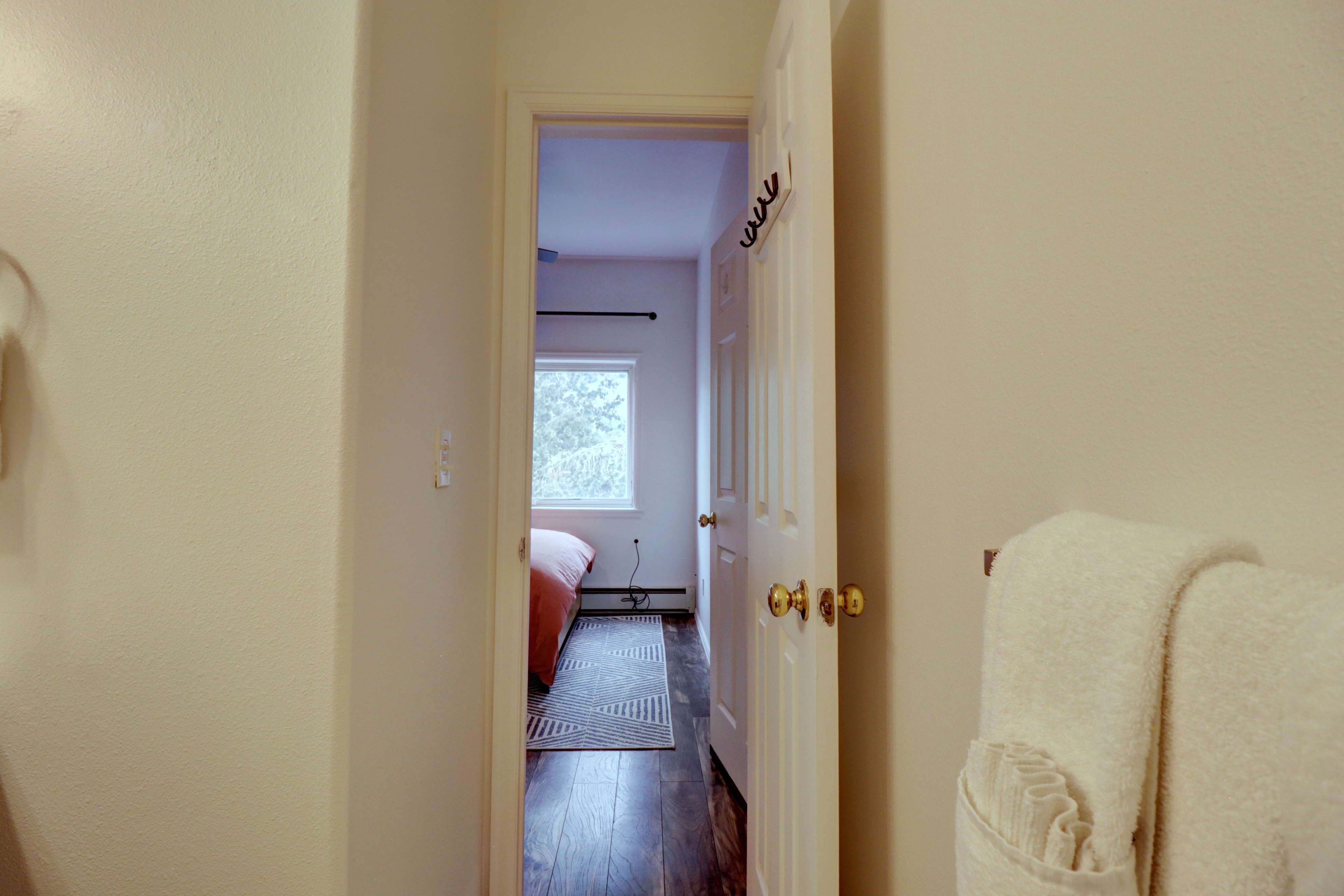 Looking from bathroom back into the bedroom.