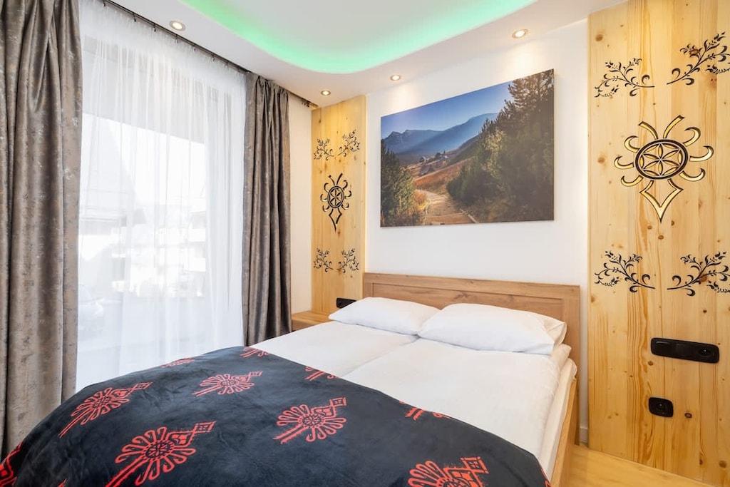 Comfortable double bed in cozy bedroom.