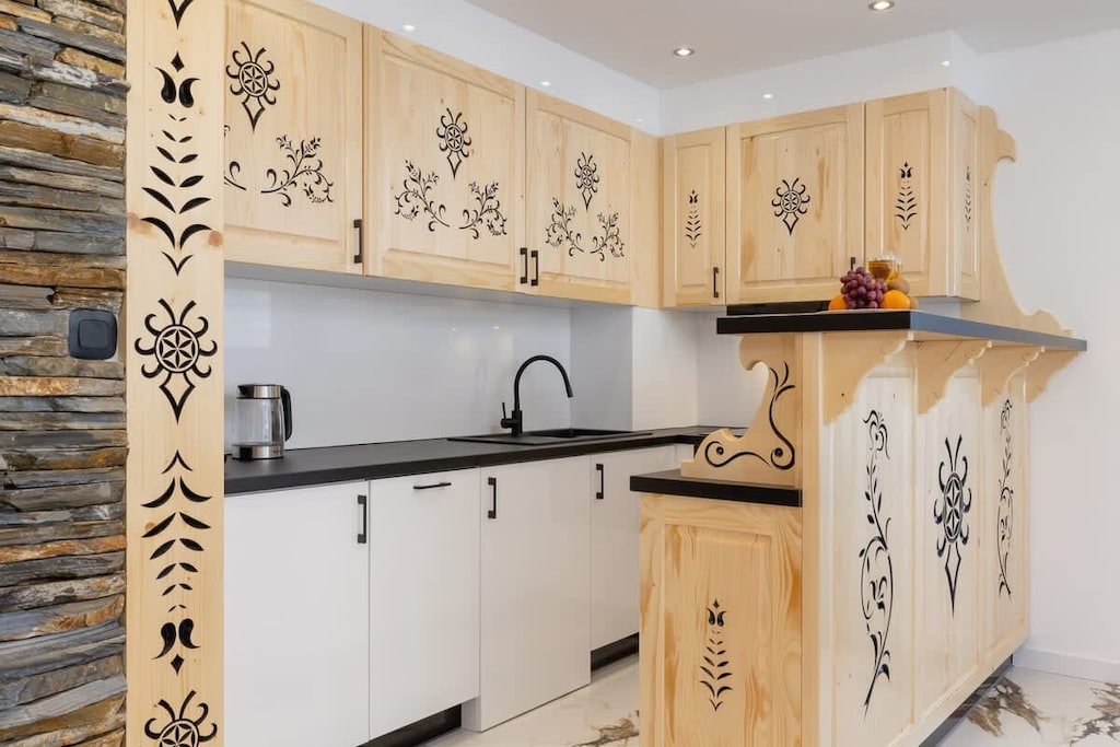 Fully equipped kitchenette with induction cooktop.