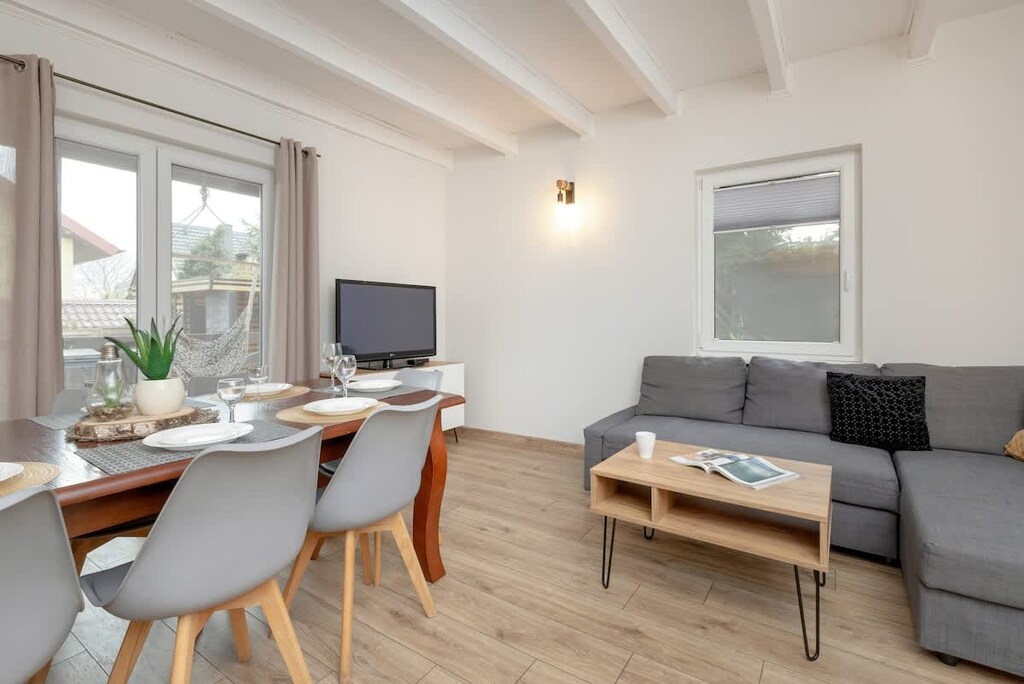 Living room with a comfortable sofa and TV. 