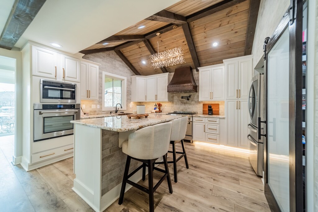 Fully stocked kitchen with stainless appliances and large pantry. 