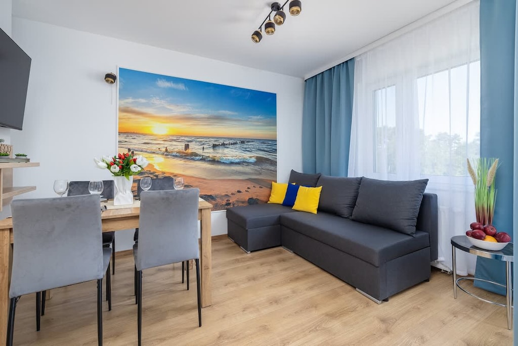 Relax in the stylish living room with a comfortable sofa and modern decor.