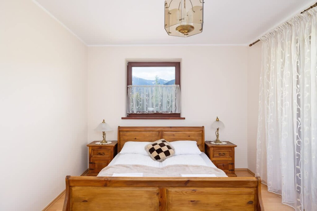 The bedroom's elegant decor creates a serene and restful environment.