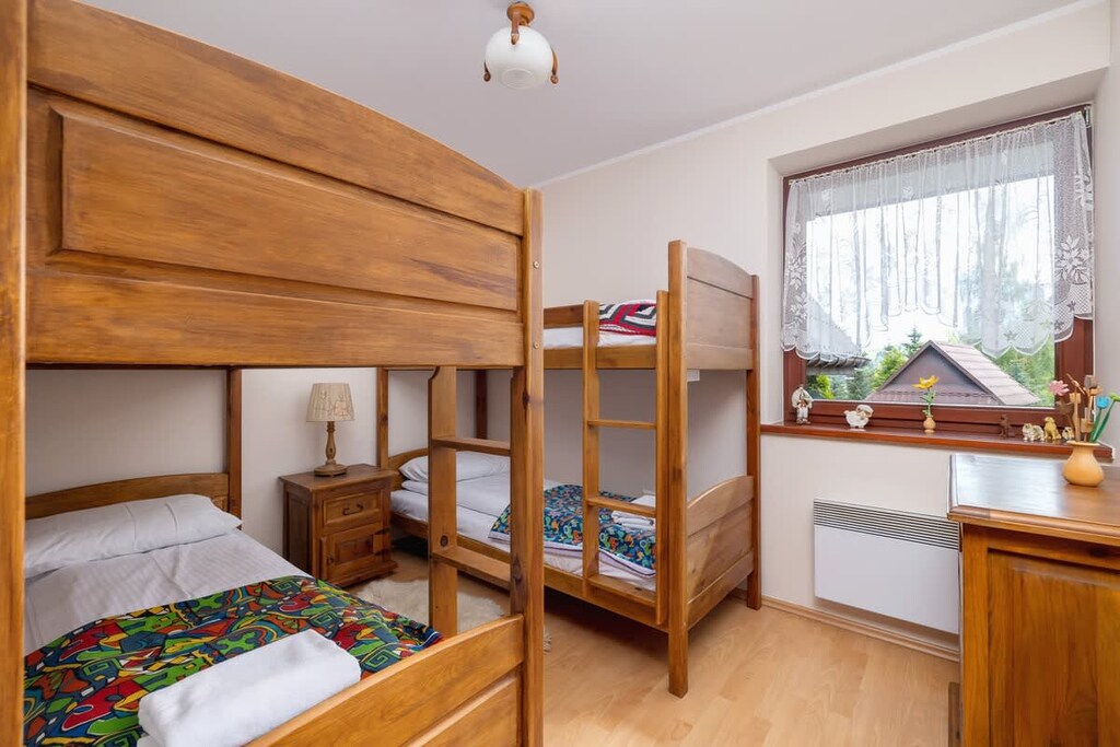 The bedroom's atmospheric design ensures a comfortable stay. 