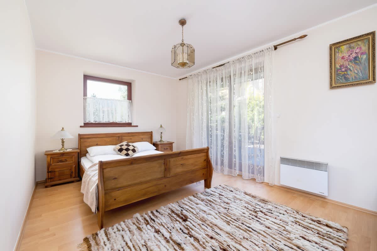 The bedroom's decor promotes a peaceful environment. 