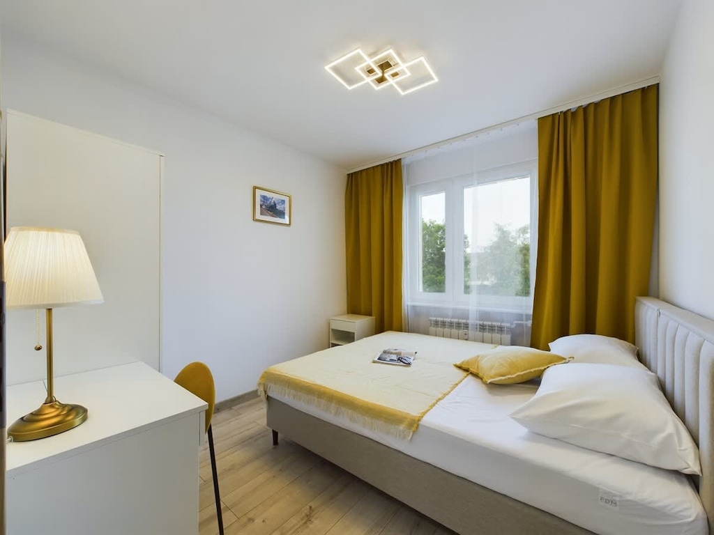 The bedroom's elegant decor creates a serene and restful environment.