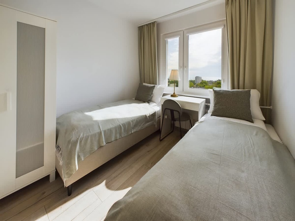 Enjoy the simplicity and comfort of the bedroom's modern design. 