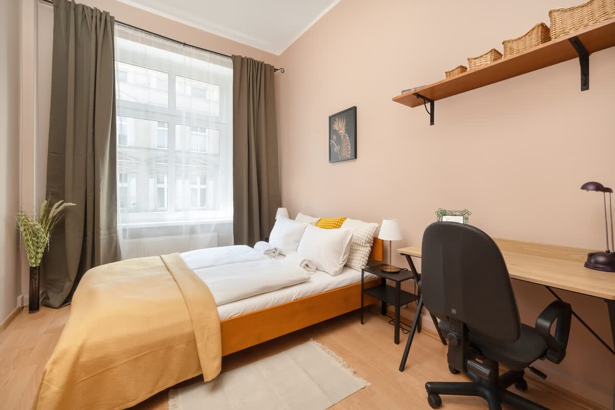 Bedroom with a desk.