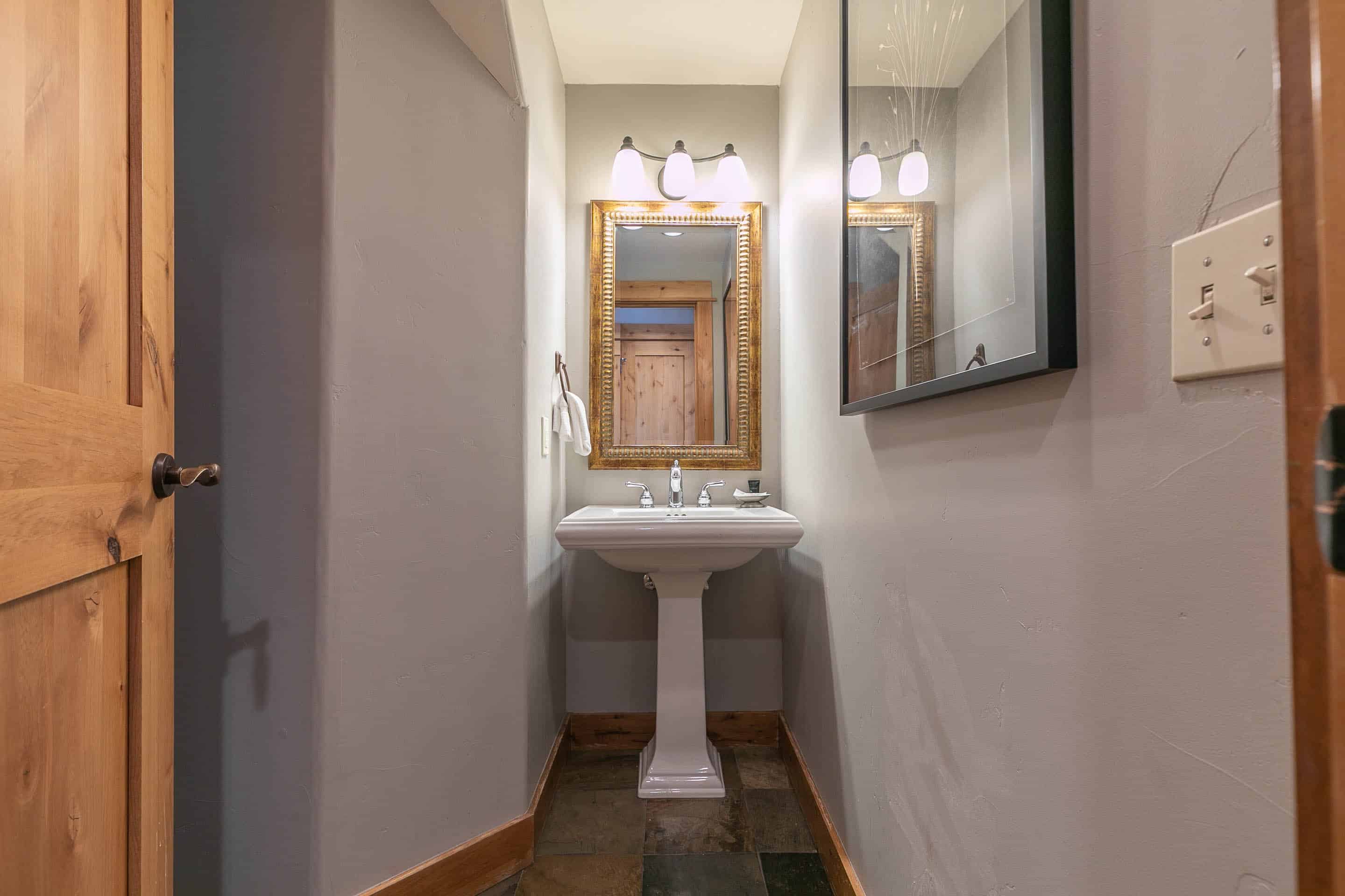 Guest powder room is featured downstairs, as well.