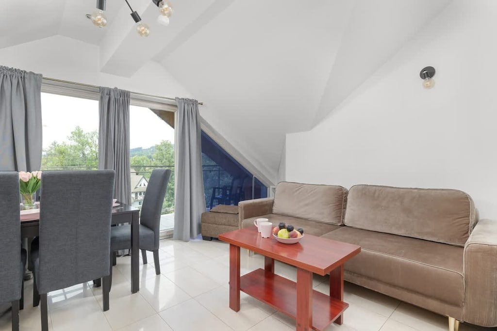 Cozy bedroom with a sofa bed and a coffee table.