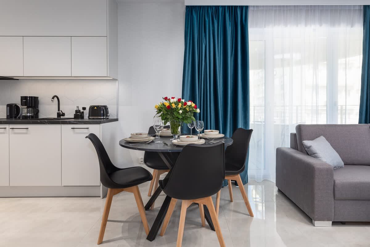 Large table with chairs for eating communal meals. 